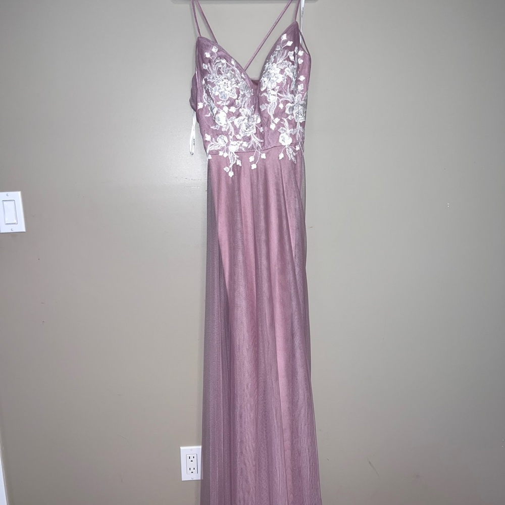 Bought this dress for a wedding a year ago for $200. Never worn. Tag is still on